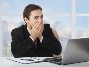 Shocked man at computer